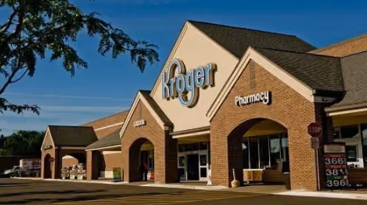 Kroger storefront with pharmacy entrance under a clear sky