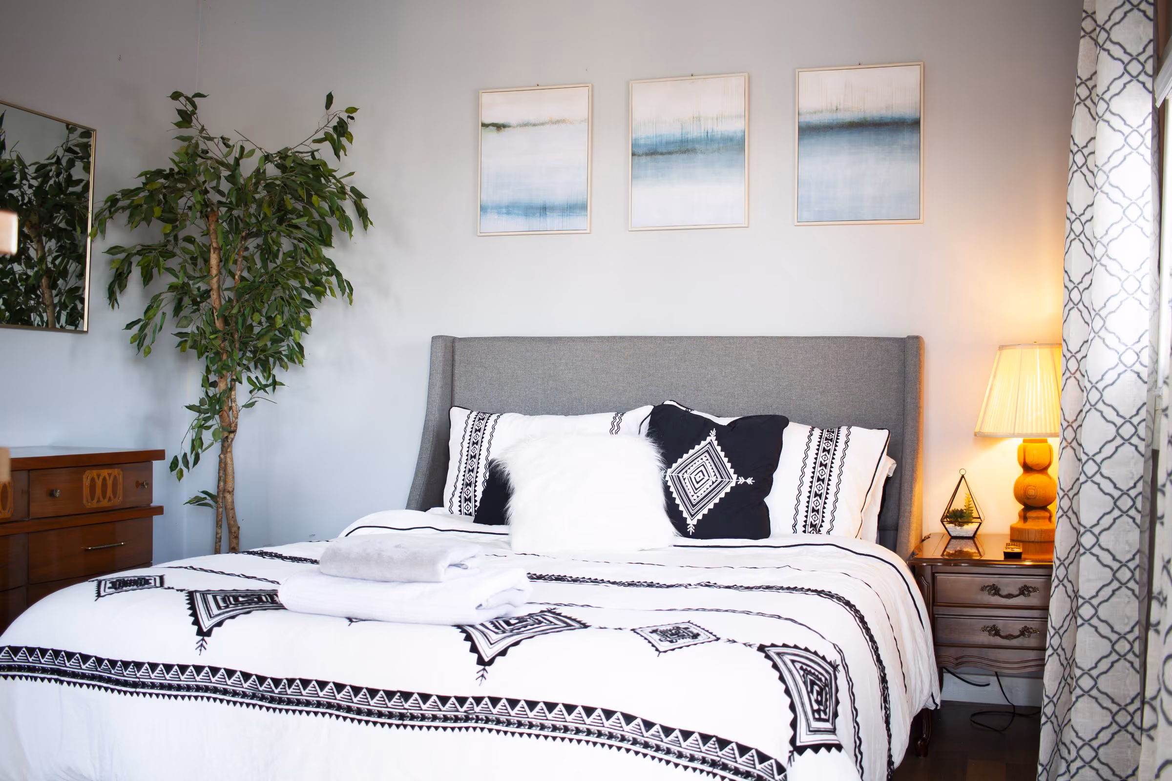 Oak Cottage guest bedroom with upholstered headboard