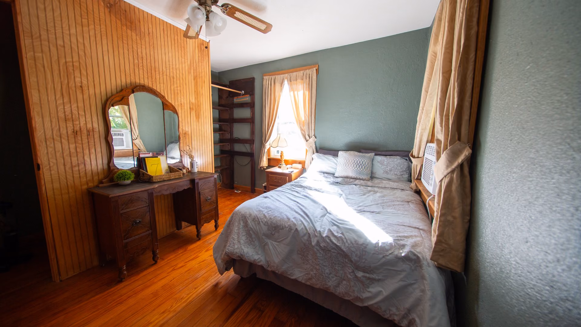 Frederick Cottage second bedroom with a bed and vintage vanity