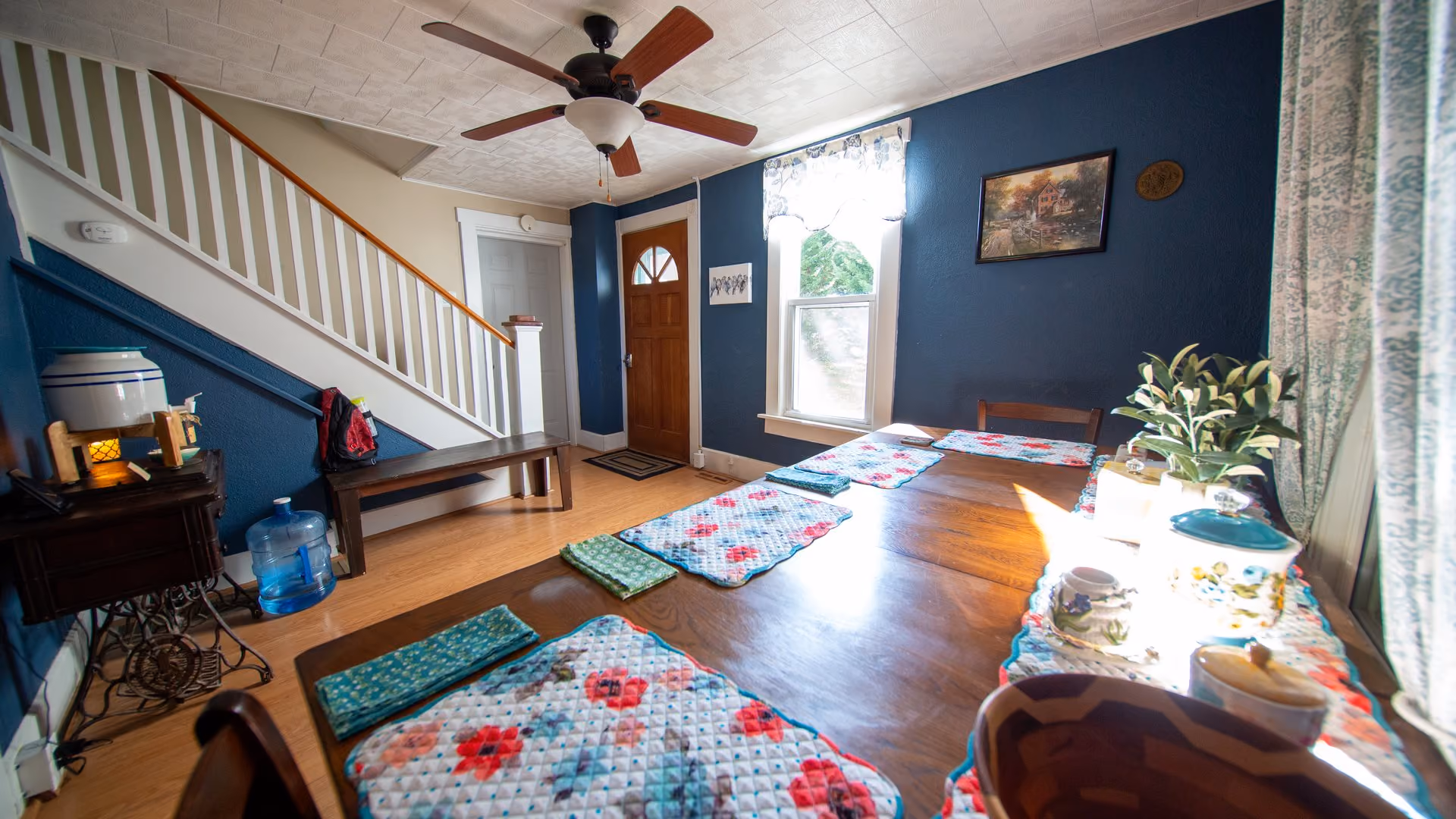 Frederick Cottage dining and entry area with table and staircase