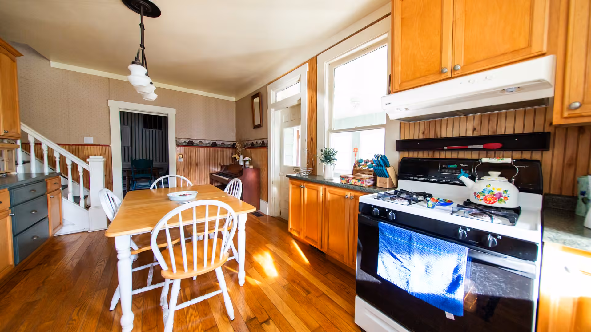 Henrietta Cottage kitchen with oak cabinets and full-size appliances