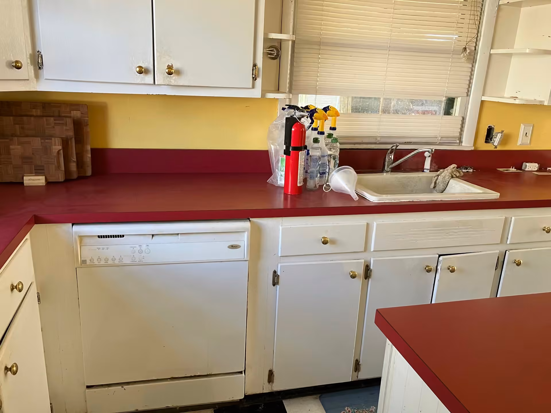 Virginia Cottage kitchen with white cabinets and red countertop